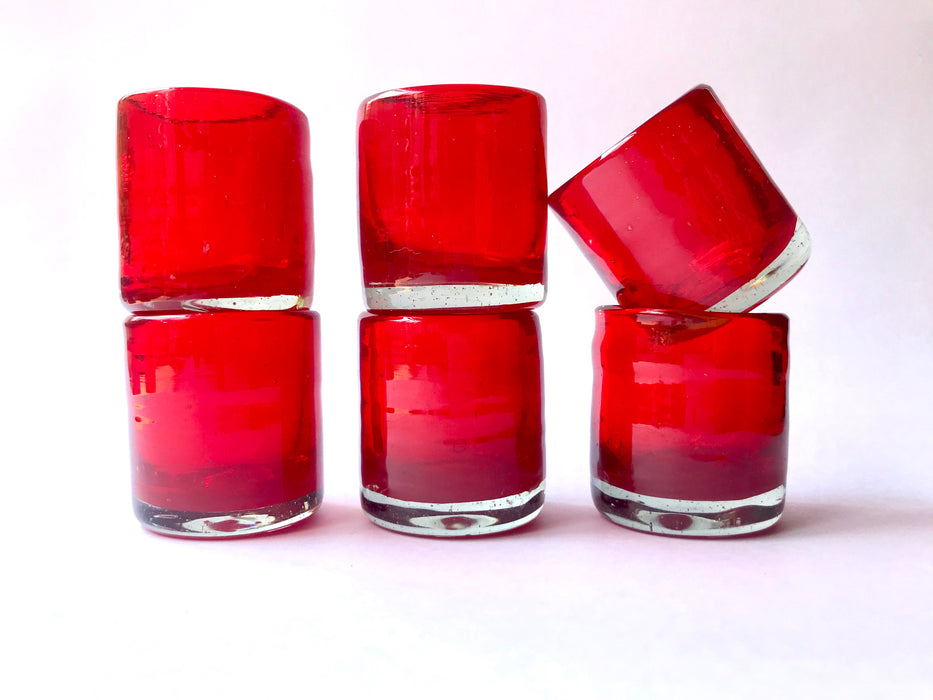 Mexico 1492: Hand blown shot glass with the trapped bubbles that pop color and start the fiesta on every occasion. Made by the master blowers in Mexico. Fire Red.