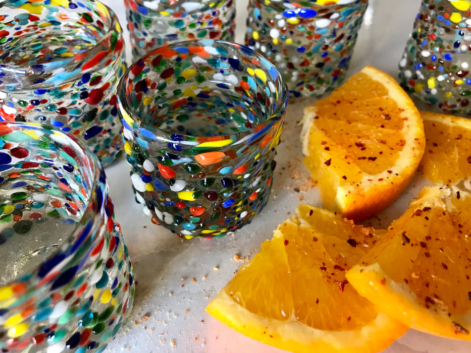 Mexico 1492: Hand blown shot glass with the trapped bubbles that pop color and start the fiesta on every occasion. Made by the master blowers in Mexico. Confetti.