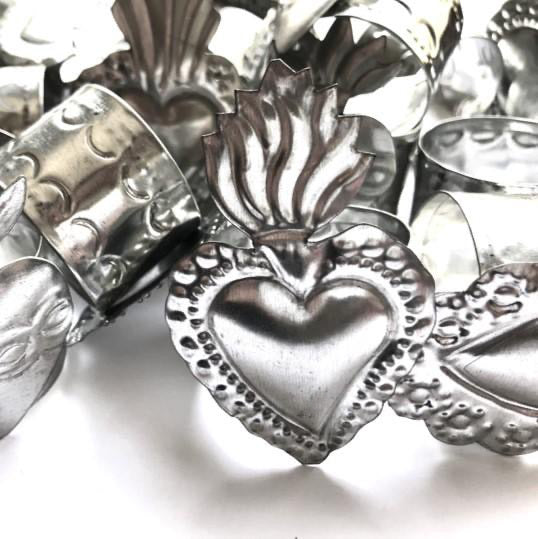 Mexico 1492: variety of Sacred Heart shaped napkin holders, made of tinplate in a repujado technique