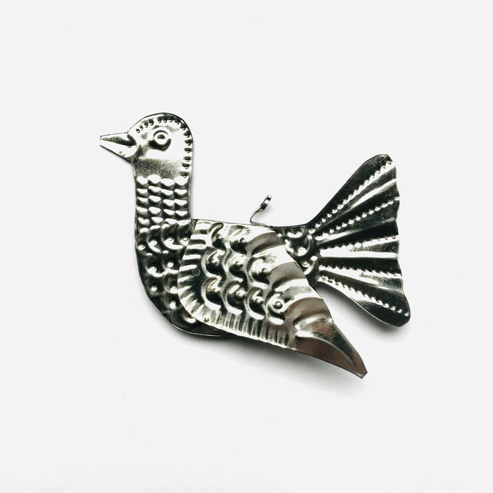 Mexico 1492 - Whimsical little bird that spreads its wings and adorns every Christmas tree, table, napkin or a fruit bowl you wish. Handmade by Oaxacan artisans, using the repujado (embossing) technique. 