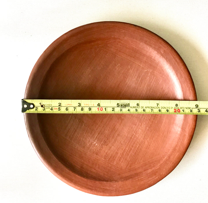 Mexico 1492 - Lunch plate with thin, flat borders, made from groovy, red clay and marked with random flame spots, adding character. Still showing the line marks of the artisan's work with the quartz stone. Lead free, unglazed.