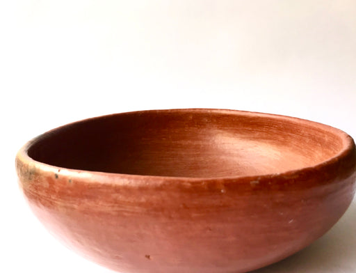 Mexico 1492: Salad bowl, made out of beautiful, red clay, and polished until a special glow is achieved. The rough beauty of the San Marcos pottery transcends its humble origins. It is usually women that work with the clay, and these bowls are no exception.   Lead free, unglazed. Thanks to the amazing, random pattern of the flame marks, no two pieces are the same. 