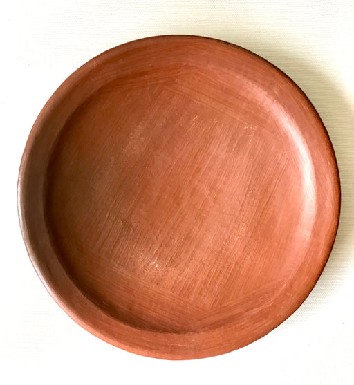 Mexico 1492 - Lunch plate with thin, flat borders, made from groovy, red clay and marked with random flame spots, adding character. Still showing the line marks of the artisan's work with the quartz stone. Lead free, unglazed.