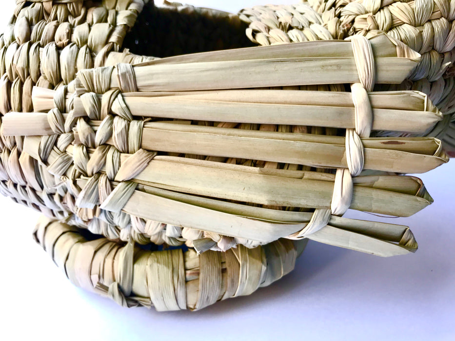 Mexico 1492: A piece that will lighten up any kitchen - whimsical hen-shaped egg basket made of chuspata (bulrush) fiber by skillful Michoacán artisans. 