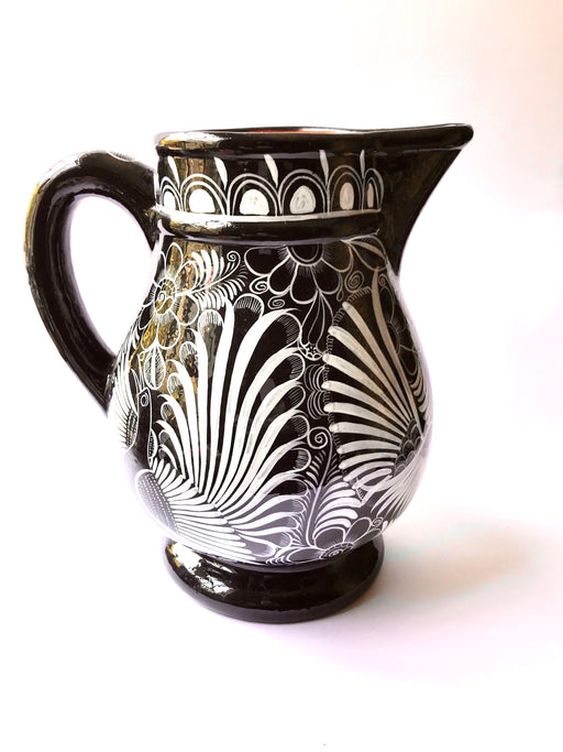Mexico 1492 - Large, glazed, hand painted pitcher. Black with white drawings of plants and birds. Artisanal work from Guerrero, Mexico. 