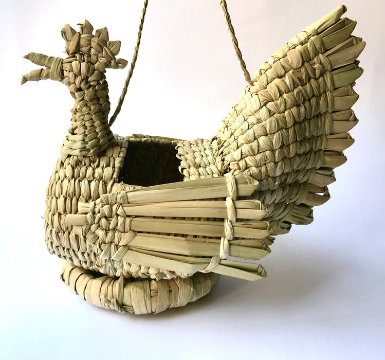 Mexico 1492: A piece that will lighten up any kitchen - whimsical hen-shaped egg basket made of chuspata (bulrush) fiber by skillful Michoacán artisans. 
