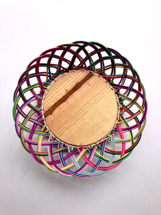 Mexico 1492: Thin wicker strings in many colors flow together and create this cheerful bread basket with a wooden base. Hand made by artisans from Estado de Mexico. 