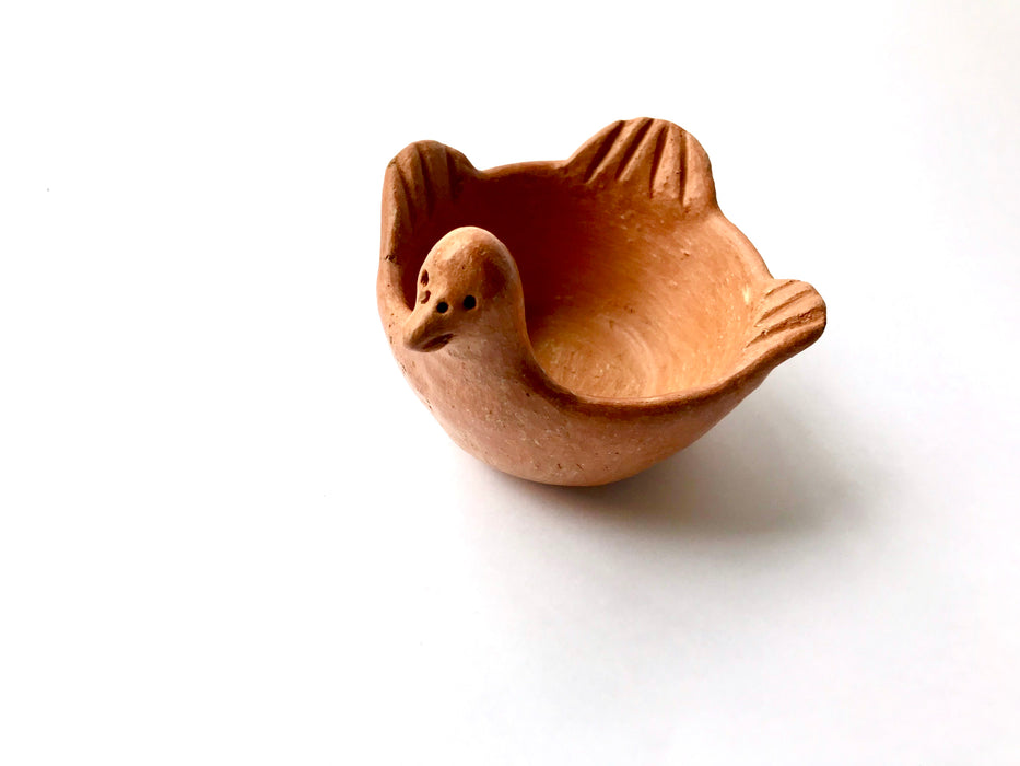 Mexico 1492: Graceful salsa bowl shaped as a bird with wings, made from red clay with a yellowish tone and marked with random flame spots, adding character. Best for serving salsa, appetizers, or salt and spices. Lead free, unglazed. Thanks to the artisanal nature of this handmade product, no two pieces are the same. 