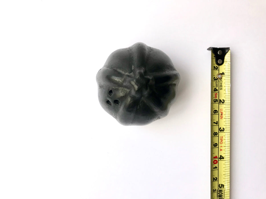 Squash shaped salt or pepper shaker made from the Oaxacan black clay. Squash is one of the early gifts of the Americas to the Old World, and this piece commemorates it well. 