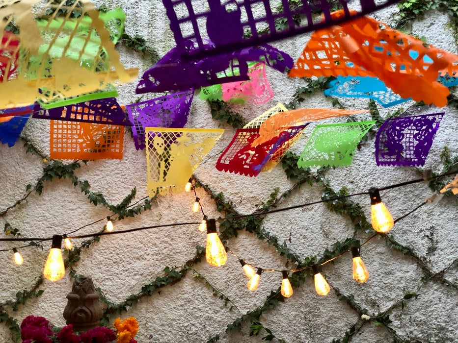 Mexico 1492: Garland of 10 banners of papel picado on a 5m (16ft) long string, with Día de Muertos (Day of the Dead) theme. Each garland carries 10 different colors and designs with the same Day of the Dead theme: skeletons carrying coffin, dancing, riding a horse or a bike, as mariachi, with cake, on a wedding, at the altar… A magnificent, colorful, so typical ornament that may be one of the most recognizable Mexican symbols today, was created and still handmade in the state of Puebla.