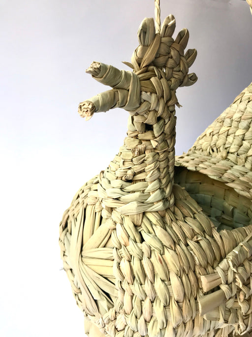 Mexico 1492: A piece that will lighten up any kitchen - whimsical hen-shaped egg basket made of chuspata (bulrush) fiber by skillful Michoacán artisans. 