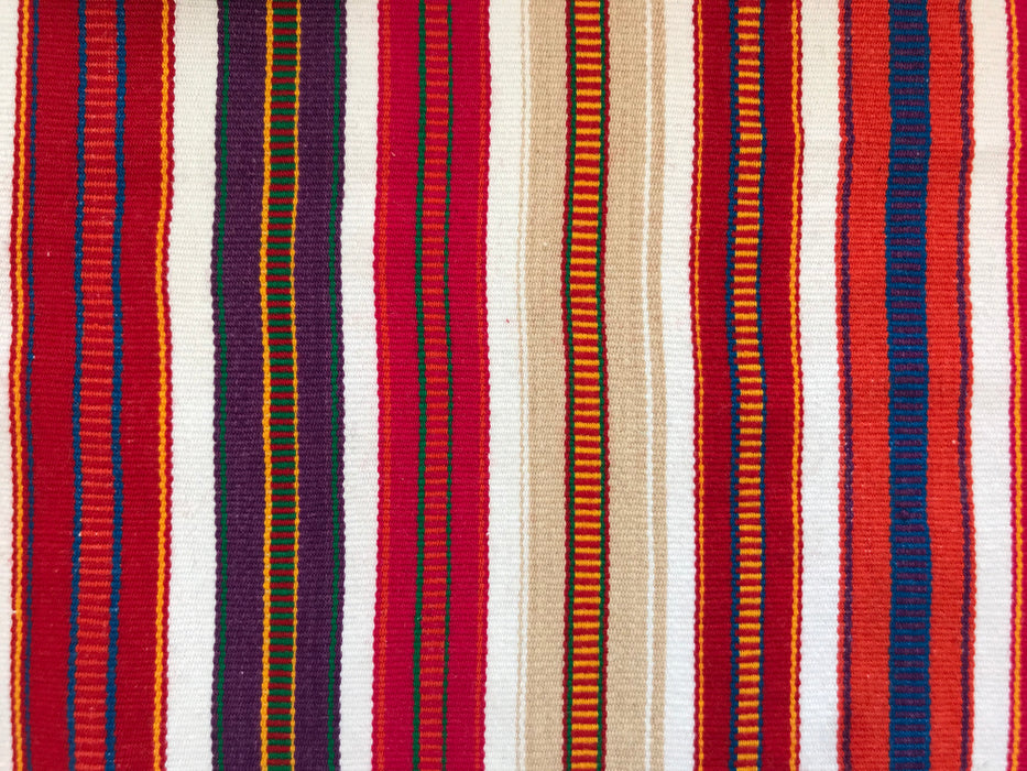 Mexico 1492: Astonishing color combinations and unrepeatable patterns come out of the imagination and skillful hands of the Chiapas artisans. The centuries old traditions of weaving using the back-strap looms is still cherished and passed on, from mothers to daughters.  Unique piece - red, purple and beige stripes on white background. L 210cm (82.7"), W 96cm (37.8")