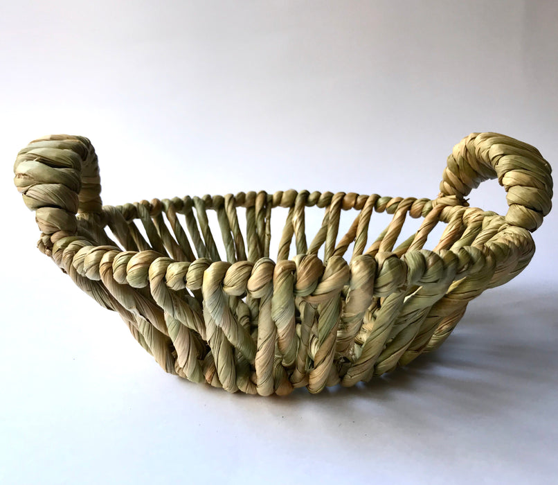 Mexico 1492: Fruit or egg basket made of tule fiber by skillful Michoacán artisans. The thick tule cords offer a comfortable, rich, full texture of this beautiful, natural piece.