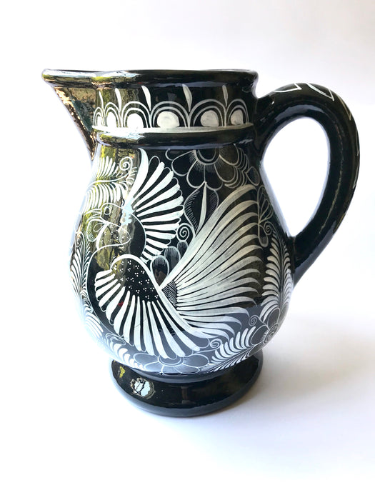 Mexico 1492 - Large, glazed, hand painted pitcher. Black with white drawings of plants and birds. Artisanal work from Guerrero, Mexico. 
