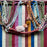 Mexico 1492 - Good for any market shopping, plus environmentally friendly.   Hand-woven on a back-strap loom by the imaginative artisans in Chiapas, Mexico, from hand-dyed cotton. Suave, more neutral colors have been put together masterfully, and adorned with a tassel of similar colors.