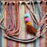 Mexico 1492 - Good for any market shopping, plus environmentally friendly.   Hand-woven on a back-strap loom by the imaginative artisans in Chiapas, Mexico, from hand-dyed cotton. Suave, more neutral colors have been put together masterfully, and adorned with a tassel of similar colors.