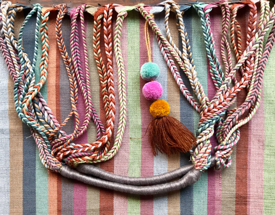 Mexico 1492 - Good for any market shopping, plus environmentally friendly.   Hand-woven on a back-strap loom by the imaginative artisans in Chiapas, Mexico, from hand-dyed cotton. Suave, more neutral colors have been put together masterfully, and adorned with a tassel of similar colors.