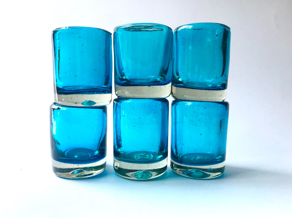 Mexico 1492: Hand blown shot glass with the trapped bubbles that pop color and start the fiesta on every occasion. Made by the master blowers in Mexico. Turquoise. 